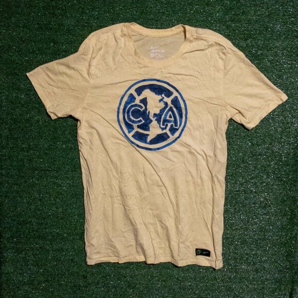 Nike Other - NIKE CLUB AMERICAS MENS T SHIRT LIGHT YELLOW BLUE LOGO SOCCER TEE SIZE MEDIUM
